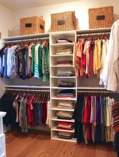 an organized closet with clothes and baskets