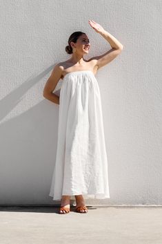 DESIGNED IN AUSTRALIA The Strapless Dress is a midi length, strapless dress made in the IL signature white linen; which is fairly lightweight, with a soft buttery hand-feel. This dress is fully lined in lightweight cotton; designed to fit firmly around the upper bust with a statement band and features a centre back invisible zipper closure. SHIPPING + RETURNS: Please allow 1-3 days for delivery (depending on location) CARE INSTRUCTIONS: Cold gentle hand wash, gentle machine wash or dry clean onl Linen Outer, White Strapless Dress, Gathered Dress, Pink Peonies, Invisible Zipper, White Linen, Midi Length, Dress Making, Strapless Dress