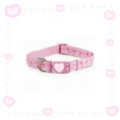 a pink dog collar with hearts and stars on it's side, in front of a white background