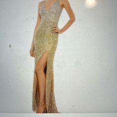 This Dress Was Worn Once. It Is A Current Sold Style On Nordstrom And Mac Duggal For $338. The Sequins On The Dress Are Lighter At The Top And Get Darker As You Get To The Bottom Of The Dress. The Dress Is Fully Lined And Has A Back Zipper Style #1068. Note There Is A Small Hole In The Netting On The Train. See Pic. Dress Altered As Follows. Bra Pads Added To Fill The Cups. Can Be Removed. Lining Was Altered As It Hung Below The Netting Hem. Dress Taken In Slightly To Remove Gap At Lower Back. Glamorous Full-length Evening Dress For Formal Events, Glamorous Full Length Evening Dress, Glamorous Formal Full-length Dress, Cocktail Floor-length Gown For Prom Season, V-neck Cocktail Gown With Sweep Train, Cocktail Gown With V-neck And Sweep Train, V-neck Gown With Sweep Train For Cocktail, Full Length Cocktail Dresses For Prom Season, Full Length Cocktail Dress For Prom