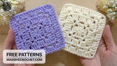 two crocheted squares are being held by someone's hands with flowers in the background