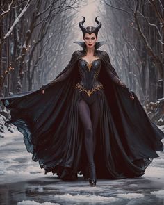 a woman dressed as maleficent walking in the snow with horns on her head