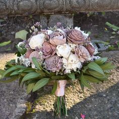 a bouquet of flowers sitting on the ground