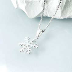 Sterling silver snowflake pendant on fine sterling silver necklace chain, bridesmaid gift OTHER SNOWFLAKE JEWELRY IN THE STORE: https://www.etsy.com/shop/alexandreasjewels/search?search_query=snowflake Snowflake size: 14mm Also available at 18mm in listing below: https://www.etsy.com/listing/205447671/snowflake-necklace-sterling-silver ADD-ON CHARMS: https://www.etsy.com/listing/205430600/add-a-charm-personalize-your-jewelry?ref=listing-shop-header-0 COMES CAREFULLY AND BEAUTIFULLY GIFT PACKAGED.  MORE FROM ALEXANDREASJEWELS: https://www.etsy.com/shop/alexandreasjewels SEE FAQ's below for shipping policy details White Snowflake Necklace For Gift, Elegant Silver Charm Necklaces For Christmas, Silver Snowflake Necklace For Gift, Sterling Silver Necklaces For Winter Gifts, White Necklace For Holiday Gift, Winter White Sterling Silver Necklaces, Holiday White Sterling Silver Necklace, Snowflake Snowflake, Necklace Girlfriend