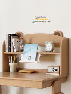 a wooden desk with a clock, books and other items on the shelf next to it