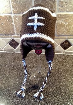 a crocheted hat with a cross on it