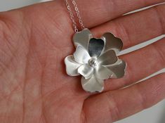 "This beautiful flower is entirely handmade. I draw each set of petals out onto sheets of sterling silver and then cut each out by hand. Each gets shaped, sanded and finished all by hand using traditional metalsmithing techniques. In the center is a ball made of fine silver. The flower is hung along an 18\" sterling silver chain with a handmade bail on the back. The flower is about 1 1/4\". + All my Jewelry comes Packed in a cute little box ready for gift giving or just for yourself! + Be sure t Flower Necklace Silver, Silver Statement Necklace, Silver Flower Necklace, Necklace Big, Metalwork Jewelry, Silver Necklace Statement, Necklace Bridal, Sterling Silver Flowers, Necklace Sterling Silver