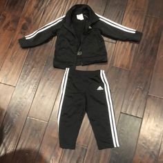 Black And White Adidas Track Suit Jacket Has Pockets Sporty Black Sets For Fall, Black Playwear Sets For Fall, Black Sets For Playwear In Fall, Black Winter Sports Sets, Adidas Winter Sets With Long Sleeve, Adidas White Long Sleeve Set, Adidas Winter Long Sleeve Sets, Fitted Black Adidas Sets, Adidas Black Sports Sets