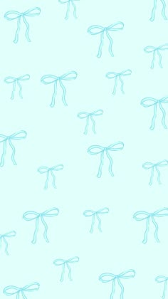 a blue wallpaper with many small bows on it's sides and one knoted at the top