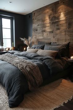 a large bed sitting next to a window in a room with black walls and wooden headboard