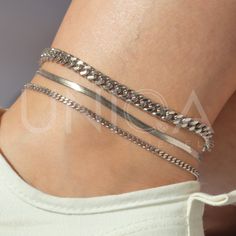 a) Snake chain anklet - 3mm b) Curb chain anklet - 3mm c) Curb chain anklet - 6mm These waterproof chain anklets will be your new fave staple all season long. high quality waterproof anklets, lead free, hypoallergenic ankle brecelet★ --------------------------------- ► PRODUCT DETAILS * Hypoallergenic Stainless Steel * This piece is WATERPROOF * Won't turn skin green * Won't irritate skin * Also unlike Sterling Silver, DOESN'T TARNISH --------------------------------- ► PACKAGING / GIFT BOX All jewelry is carefully packed in our signature UNIQA boxes. To reduce waste, we often put an order with multiple pieces in one or two gift boxes. If you would like your order to be boxed separately or if only part of your order is intended as a gift, please leave a note at checkout and we'll be happy Adjustable Chain Bracelet Summer Gift, Adjustable Chain Bracelet As Summer Gift, Adjustable Chain Bracelet For Summer Gift, Elegant Beach Chain Bracelet, Minimalist Metal Bracelets For Summer, Adjustable Chain Bracelet For Summer, Adjustable Summer Chain Bracelet, Summer Minimalist Metal Bracelets, Adjustable Chain Bracelets For Summer