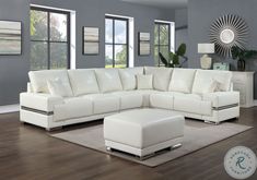 a large white sectional couch in a living room