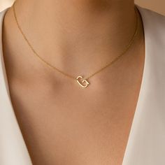 Our Mini Sideways Initial Necklace is the perfect personalized gift and timeless keepsake. With your choice of letter, this delicate, minimal design can be customized with an off-center initial to bring your whole outfit together. Material: High Quality Solid 925 Sterling Silver Finish: Sterling Silver ∙ 18K Gold ∙ Rose Gold Featuring ~12.5mm X 7mm Letter Charm SKU: MM-NM118F39 Minimalist 14k Gold Open Heart Jewelry, Modern Open Heart Jewelry For Gifts, Modern Open Heart Jewelry For Gift, Elegant Heart-shaped Simple Jewelry, Minimalist Sterling Silver Name Necklace For Everyday, Everyday Minimalist Sterling Silver Name Necklace, Minimalist Initial Pendant Name Necklace In White Gold, Dainty 14k Gold Monogram Name Necklace, Minimalist 14k Gold Necklaces For Mother's Day