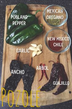 the ingredients for pozole are displayed on a cutting board with peppers and garlic