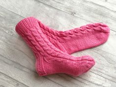 These pink socks are so comfortable you'll want to wear them all year long. Our hand knit women socks provide a higher quality of craftsmanship, which means you can enjoy them year round, year after year. Never again will you leave the comfort of your warm bed to be awoken by an ice cold floor beneath your feet. Cuddling up with a blanket in front of the television will no longer be a choice of warm feet or warm shoulders. You'll no longer need a space heater beneath the desk in your freezing of Cable Knit Socks, Ladies Socks, Cosy Socks, Luxury Socks, Pink Clothing, Pink Slippers, Hand Knit Socks, Socks Gift, Pink Socks