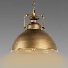 an antique brass finish pendant light hanging from the ceiling