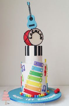 a birthday cake with musical instruments on top