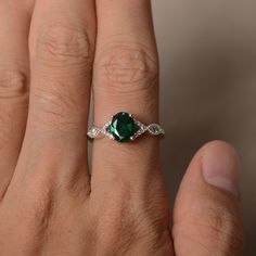 This is a gorgeous handmade creation. Its beauty is its simplicity & Elegance. The 6*8 mm oval shape faceted lab Emerald is crafted in solid sterling silver and with rhodium plated. Main stone weight about 1.13 ct. CZ as accents. All item is sent in a beautiful gift box If you have any idea of design your ring,pls contact me directly. You can realize more lovely stuff clicking the link https://www.etsy.com/shop/knightjewelry?refshopsection_shophome_leftnav Please leave the correct address an Rings Oval, May Birthstone Rings, Emerald Rings, Birthstone Rings, Wedding Ring For Her, Oval Cut Engagement Ring, Rings Unique, Engagement Ring For Her, Wedding Rings Solitaire