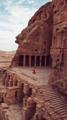 an ancient building in the desert with steps leading up to it