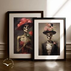 two framed photographs of skeletons in hats and gowns, one with flowers on its head