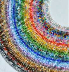 multicolored glass beads are arranged in a circle