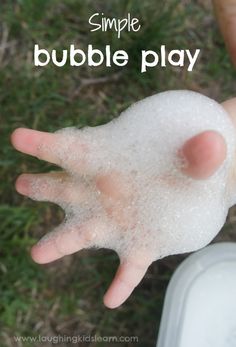 a hand is covered with bubbles and the words simple bubble play are in front of it