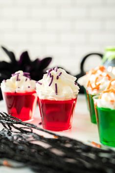 halloween cupcakes with white frosting and sprinkles