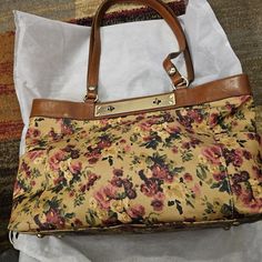 This Gorgeous Bag Is Like New. The Patricia Nash Ria Tote Patina Coated Linen Canvas With Antique Rose Design. The Leather Is 100 Percent Full Grain With A Burned Edge Finish. It Has A Double Turn Lock Closure. The Hardware Is All Antique Brass. It Is Made With Heavy Handcrafted Stitching. Perfect At 13 1/2 10 1/4 X 5 Beige Floral Print Satchel Shoulder Bag, Chic Formal Bags With Floral Print, Chic Formal Bag With Floral Print, Elegant Floral Print Shoulder Bag For Everyday Use, Elegant Floral Print Shoulder Bag For Everyday, Elegant Floral Print Shoulder Bag, Elegant Brown Bags With Floral Print, Elegant Floral Print Shoulder Bag For Shopping, Cream Rectangular Bag With Floral Print