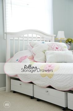 a white bed topped with lots of pillows