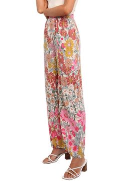 An exquisite floral print swirls around these flowy lounge pants styled with an elastic waist so you can enjoy moving or lounging with ease every day. Elastic waist Front slant pockets Unlined 100% rayon Hand wash, dry flat Imported Bohemian Flowy Bottoms With Floral Print, Flowy Bohemian Bottoms With Floral Print, Bohemian Style Flowy Bottoms With Floral Print, Floral Print Rayon Wide-leg Pants, Spring Printed Rayon Bottoms, Multicolor Elastic Waistband Rayon Bottoms, Multicolor Rayon Bottoms With Elastic Waistband, Bohemian Wide Leg Floral Pants For Spring, Multicolor Floral Print Rayon Bottoms