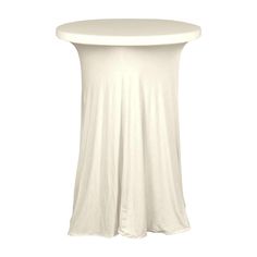 a white table with a round top and curved skirt on the bottom, isolated against a white background