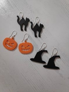 Celebrate the magic of Halloween with our delightful Halloween Charm Earrings! These 3D printed earrings feature iconic spooky designs like pumpkins, ghosts, bats, witch hats, black cats, and skulls, perfect for adding a playful, eerie touch to your outfit. Crafted with Care and Style Each pair of earrings is meticulously crafted to bring out the details of these beloved Halloween symbols. Whether you want to embrace the festive fun with a grinning pumpkin or exude mystery with a sleek black cat Spooky Jewelry, 3d Printed Earrings, Printed Earrings, Halloween Symbols, Ghost Witch, Bat Earrings, Hats Black, Witch Hats, Pumpkin Ghost