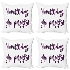 four white pillows with purple lettering on them