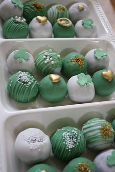 green and white chocolates with gold decorations on them