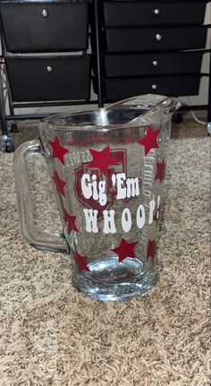 a glass pitcher sitting on top of a counter