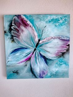 a painting of a butterfly on a wall