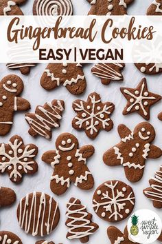 gingerbread cookies with white icing are on a sheet of parchment paper and the words, gingerbread cookies easy vegan