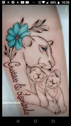 a tattoo with an image of a lion and its cub