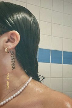 a woman with a tattoo on her neck