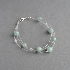 This mint green, multi-strand bracelet has been created using jade beads and sparkling crystals. These duck egg blue, three strand bracelets make perfect bridal party gifts for bridesmaids. This elegant, aqua bracelet measures 7.5 inches / 19cm in length and is completed with a silver plated lobster clasp. I have added a 1 inch extension chain to allow you to adjust your bracelet to fit. Your sage jewellery will arrive gift wrapped in the gift box pictured. All of my items are carefully packaged Bridal Party Gifts For Bridesmaids, Blue Bridal Party, Mint Green Jewelry, Three Strand Bracelet, Sage Wedding, Multi Strand Bracelet, Blue Bridal, Wedding Jewelry Bracelets, Blue Bridesmaids