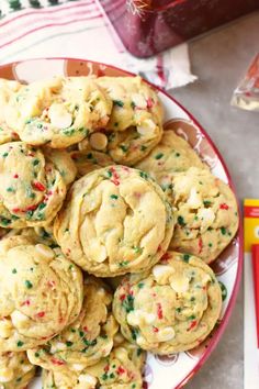 a plate full of cookies with sprinkles on it