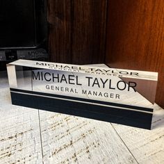 michael taylor's general manager sign sitting on the floor