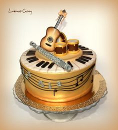 a cake decorated with musical instruments and music notes