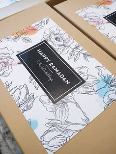 two boxes with floral designs on them sitting next to each other, one has a label that reads happy ramaan