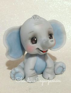 an elephant figurine is sitting on the floor