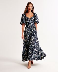 Elevate your wardrobe with the Abercrombie & Fitch Hardware Drama Puff Sleeve Maxi Dress, a stunning ensemble that combines elegance with a touch of boldness. Perfect for any sophisticated outing, this dress features:

- Size: XXS PETITE
- Color: Dark Indigo Floral
- Material: Body - Viscose, Cotton; Lining - Polyester
- Gender: Female

This exquisite piece showcases a flattering sweetheart neckline adorned with distinctive hardware details, on-trend puff sleeves, and a dramatic bow-back that ad Volume Skirt, Puff Sleeve Maxi Dress, 2024 Wishlist, Skort Dress, Indigo Floral, Short Sleeve Maxi Dresses, Dark Indigo, Denim Mini Dress, Sleeve Maxi Dress