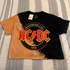 Nwt Ac/Dc Women’s Crop Tee Black And Orange Washed Tee 1xl Black Band Logo T-shirt For Fall, Casual Orange Fan Merchandise Top, Ac Dc Band, Dc Women, Empire Waist Tops, Stripped Tops, Front Tie Shirt, Crop Top Shirts, Black And Orange