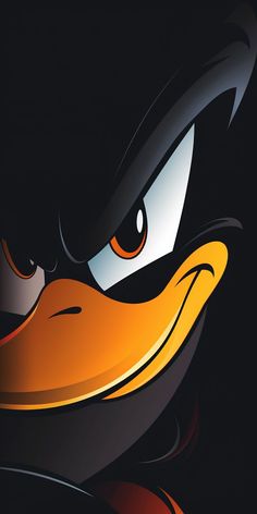 a close up of an angry bird's face with orange eyes and black background