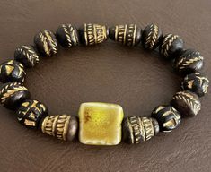 Bracelet measures 7 1/2 un stretched.    Smallest bead is 9.1mm x 9.4mm. Larger bead is 13.6mm x 9mm Luxury Brown Bracelets With 8mm Beads, Gold Clay Bead Bracelet, Bracelet For Him, Clay Bead Bracelet, Clay Bead, Elegant Bracelet, Clay Beads, Yellow And Brown, Bead Bracelet