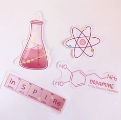 some stickers that are on top of a white surface with pink and yellow designs